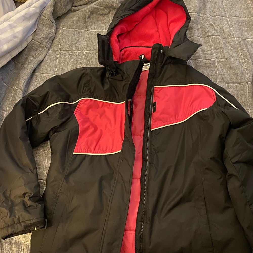 Black and pink girls winter coat. Barely used. In great shape. Removable hood